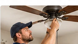 Professional repairing a ceiling fan